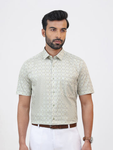 Chutney Print Shirt, a lime green geometric printed cotton satin shirt with a tailored fit and short sleeves.