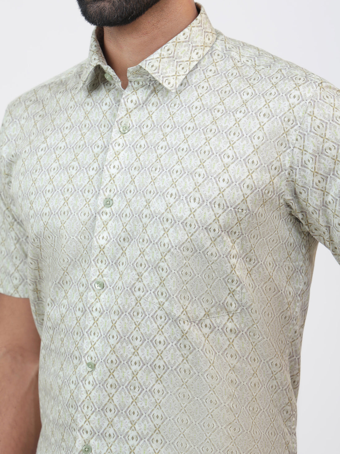 Chutney Print Shirt, a lime green geometric printed cotton satin shirt with a tailored fit and short sleeves.